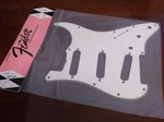 New - Genuine Fender '65 Strat Pickguard, S/s/s, 3-ply Eggshell, 009-4392-049. Fixed Price $33.09.